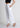 White pintuck trousers, angled front view