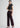 Model in wine wide leg trousers, side pose