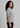 Flurr women’s textured ruffle-collar top shown from the side, styled as an elegant officewear blouse for modern workwear